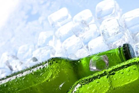 Cold beer in ice Stock Photos