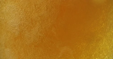 Cold beer is poured into a glass. Cold Light Beer in a glass with water drops Stock Footage 156752045