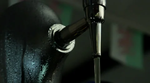 Cold beer pump pouring beer on and off Stock Footage 35193045