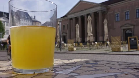 Cold beer on a table filmed in slow motion Stock Footage 255473435
