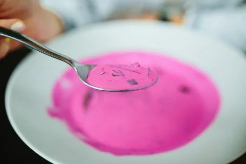 Cold beetroot soup. Focus on spoon. Stock Photos