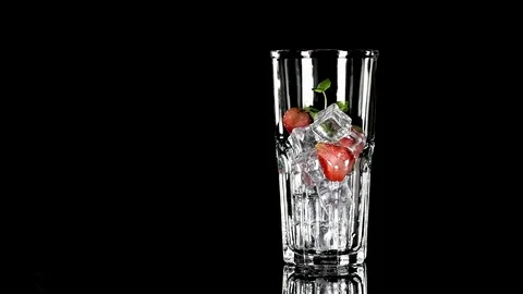 Cold beverage with Strawberry and mint on a black background Stock Footage 91892693
