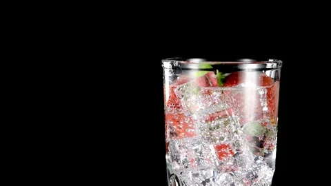 Cold beverage with Strawberry and mint on a black background closeup Video stock 91892969