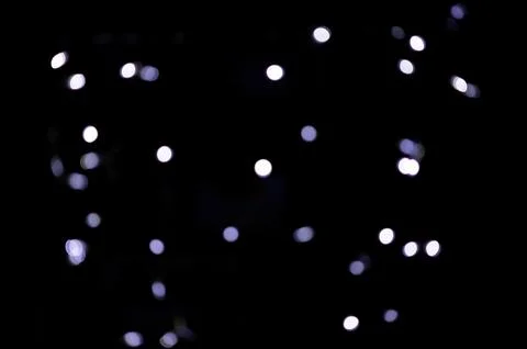 Cold blue small size real single color bokeh or soft out of focus blurred lights Stock Photos