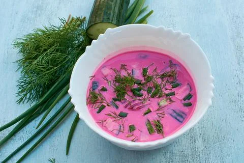 Cold borscht of their beets. Feathers onions, fresh dill. A cold dish on a ho Stock Photos
