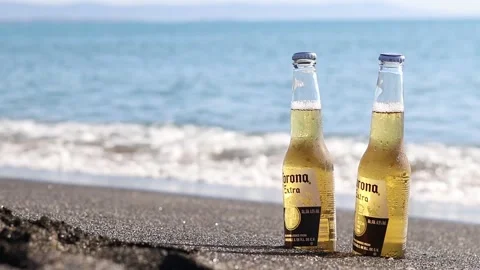 Cold bottles of Corona beer on the beach by the ocean Video stock 342797329