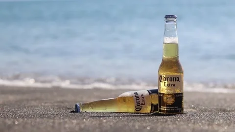 Cold bottles of Corona beer on the beach by the ocean Stock-Footage 342797335