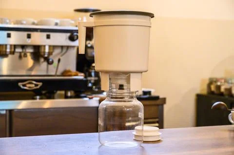 Cold brew coffee brewer making craft drink at cafe Stock Photos