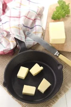 Cold butter cubes in a pan Foto stock