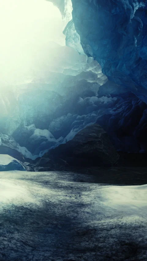 Cold cave with icy blue walls and stark white ground in low light Stock Footage 336172310