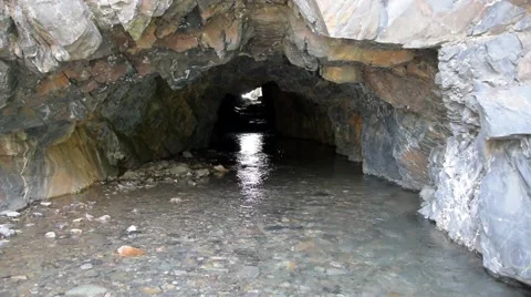 A cold, clear mountain stream that flow through a cave. Stock Footage 53373668