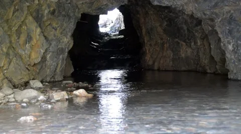 A cold, clear mountain stream that flow through a cave. Stock Footage 53373670