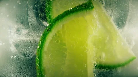 Cold cocktail with lime, tonic and ice, closeup Stock Footage 65366851