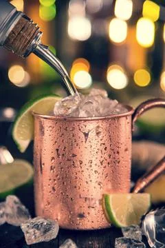 Cold coffee drink with ice, beans and splash, close-up. Stock-Fotos