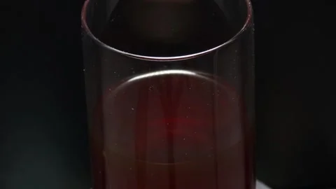 Cold coffee with flavored red color black rotates 360 degrees, at 4k resolution Stock Footage 248618708