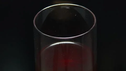Cold coffee with flavored red color black rotates 360 degrees, at 4k resolution Stock Footage 248618898