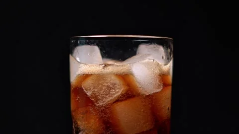 Cold Cola Drink with Ice Cubes on Dark Background. Stock Footage 328118484