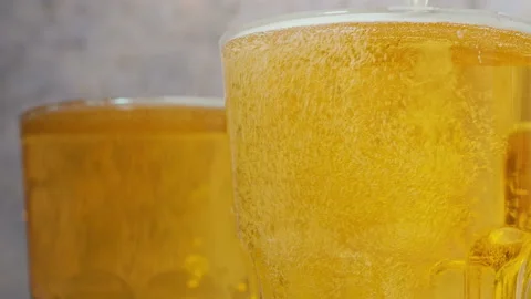 Cold craft  light Beer is pouring from bottle on wooden Table Vídeo Stock 194307573