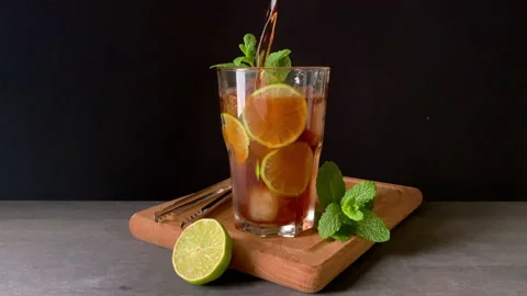 Cold Cuba Libre pours into a glass. Summer drink Stock Footage 155151886