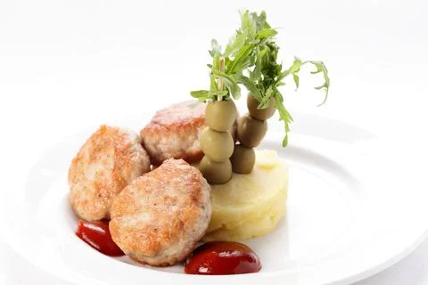 Cold cutlets with garnish Stock Photos