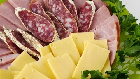 Cold cuts with cheese and herbs,a large portion. Stock Footage 129069257