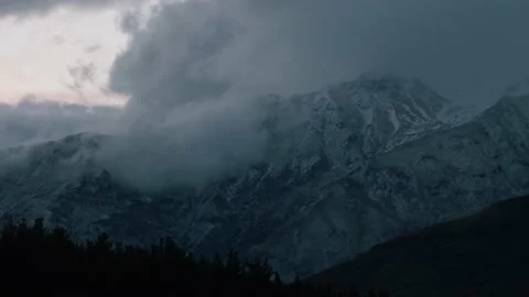 Cold dark mountains surrounded by clouds Stock Footage 140610824