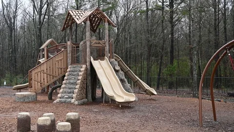 Cold day on the playground slide. Stock Footage 121386918