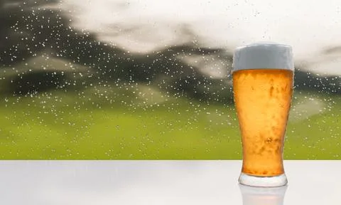 Cold draft beer in tall clear glass. The top is beer foam. There are water .. Stock Photos