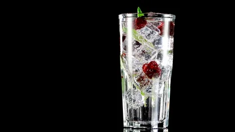 Cold drink with blackberries and mint on a black background Stock Footage 91893328