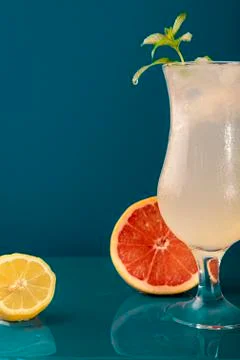 Cold drink with lemons and grapefruit. Stock Photos