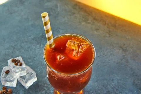 Cold drink or Nitro Coffee drink in a glass with bubble foam and ice Stock Photos