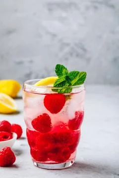 Cold drink Raspberry Lemonade with mint in glass. Stock Photos