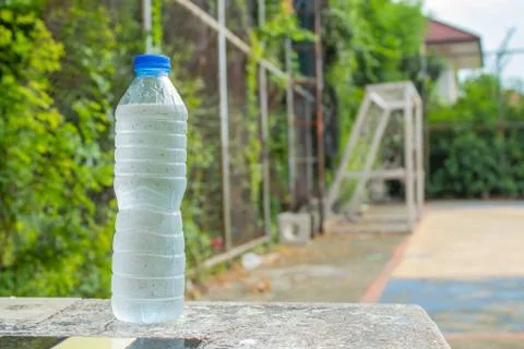 Cold drinking water in bottles on the table. In the soccer field.. Stock Photos