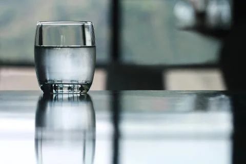 Cold drinking water glass on table Stock Photos