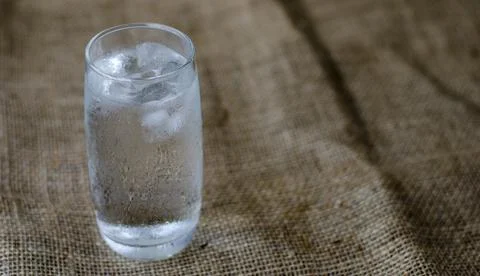 Cold drinking water with ice in a clean glass, drink healthy and cool down Stock Photos