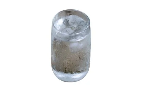 Cold drinking water with ice in a clean glass isolated on white background 스톡 사진