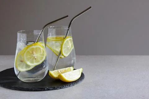 Cold drinks in small bottles. Lemon lemonade with ice. Mojito coctail. Stock Photos