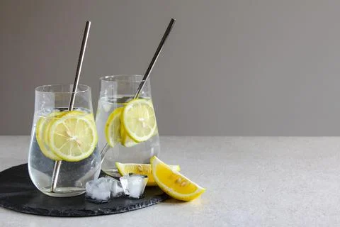 Cold drinks in small bottles. Lemon lemonade with ice. Mojito coctail. Stock Photos