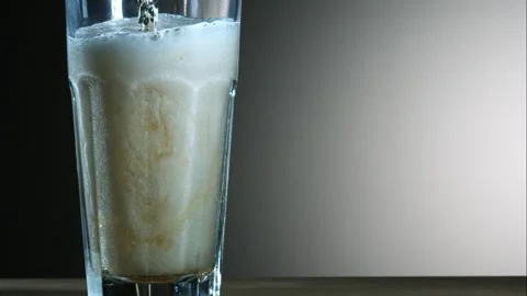 Cold Foamy Beer Being Poured Into A Tall Glass Stock Footage 326291920