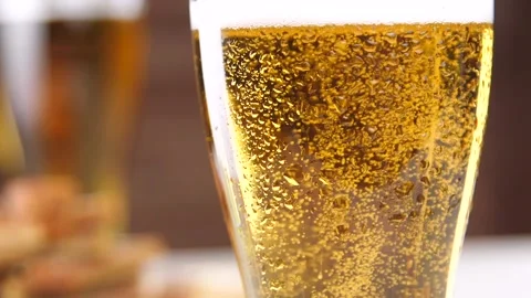 Cold fresh beer with bubbles and foam in the glass Stock Footage 88494745