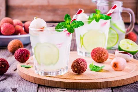 Cold fresh lemonade with lychee, lime and mint in glass Stock Photos
