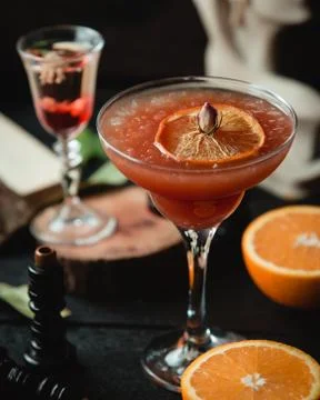Cold fruit cocktail with slice of lemon Stock Photos