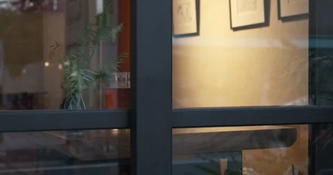 A cold glass of beer seen from outside through a window Stock Footage 236596398