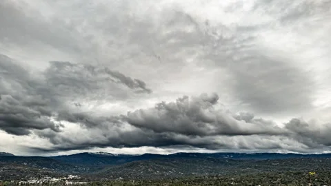 Cold, Grey, Depressing Winter Storm Clouds above California Mountain Town Stock Footage 282516719