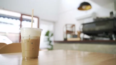 Cold ice milk coffee in a plastic cup Stock Footage 140516714
