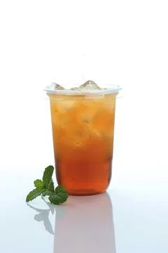 Cold Ice Tea with Mint Leaf on White Table Stock Photos