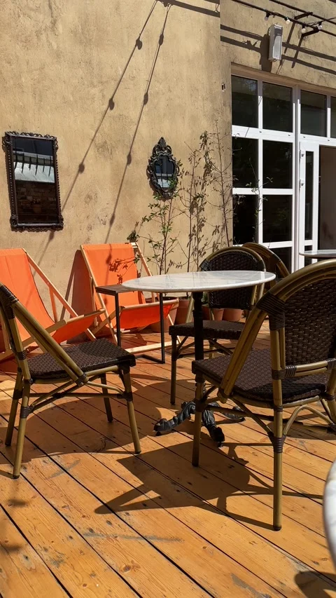 A cold iced coffee in a glass on a table at an outdoor restaurant veranda Stock Footage 315158831