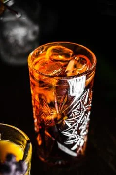 Cold iced tea with on black background Stock Photos