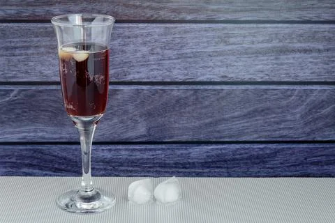 Cold kvass from dark bread with ice cubes. On a dark wooden background. Stock Photos