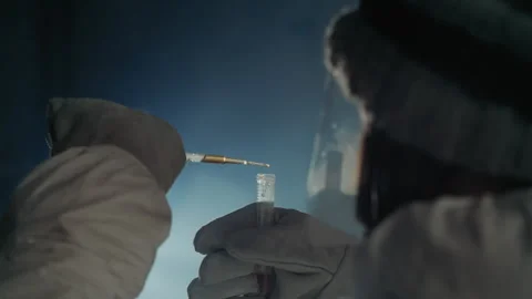 Cold lab environment with precise measurement and sterile handling. Gloved Video stock 342740735